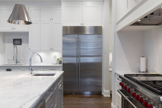 Kitchen with stainless steel fridge and oven